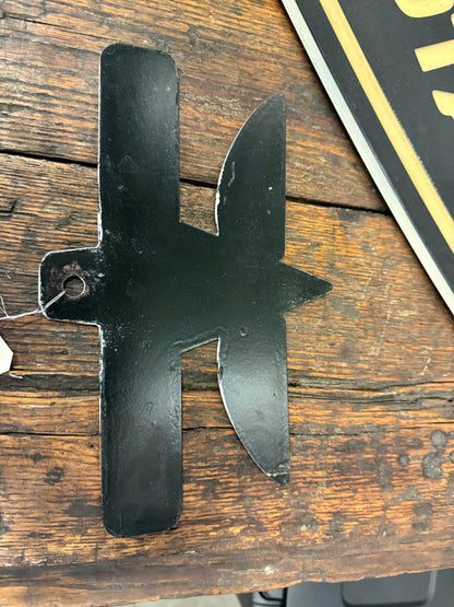 Porcelain flying a giant power sign